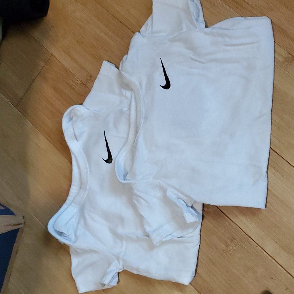 Two Nike onsies